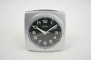 Clock, Alarm, SQUARE W/ROUND BLACK FACE W/SECOND TIMER & GLOW IN THE DARK NUMBERS, PLASTIC, SILVER