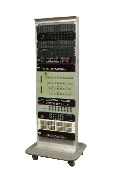 Electronic, Rack, RACK W/ELECTRONIC PANELS/COMPONENTS INCL BUTTON/TOGGLE SWITCH PANELS, WIRES, VENTS, ON ROLLING GREY BASE, METAL, MULTI-COLORED