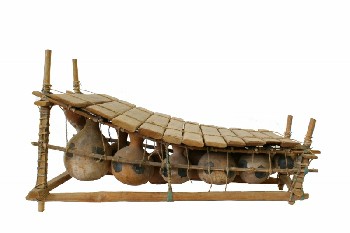 Decorative, Fruit/Veg, SLOPED FRAME W/SLAT TOP, 12 HANGING CARVED GOURDS, ROPE TIES & WRAPPING, AGED, LOOKS LIKE A XYLOPHONE, PRIMITIVE STYLE INSTRUMENT OR SIMILAR, WOOD, BROWN
