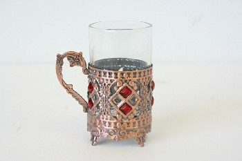 Drinkware, Misc, CYLINDRICAL GLASS IN ORNATE FOOTED HOLDER W/HANDLE & RED STONES, METAL, COPPER
