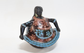 Statuary, Tabletop, ROBUST WOMAN HOLDING SKIRT W/PAINTED PINK & BLUE FLOWERS, CENTRAL OR SOUTH AMERICAN STYLE, CERAMIC, BLACK