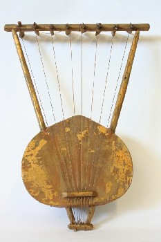 Music, String, 8 STRINGED INSTRUMENT MADE FROM HALF COCONUT SHELL,PAINTED GOLD (FLAKING), COCONUT SHELL, BROWN