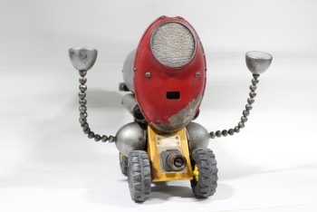 Toy, Robot, ROBOT W/HOMEMADE OR STEAMPUNK LOOK FROM PARTS, YELLOW TOY TRUCK BASE, RED FRONT PANEL W/HEADLIGHT, MOVEABLE ARMS, AGED, PLASTIC, GREY