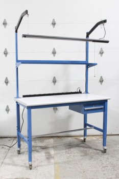 WORK BENCH W/OVERHEAD FLOURESCENT LIGHT BAR, DESK IS 39x60x30" W/LT GREY SURFACE & POWER BAR, BLUE METAL UPPER SHELF, 1 DRAWER, ROLLING, BULB NOT INCLUDED, Furniture