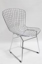 Chair, Side, GRID OF WELDED STEEL RODS, CONNECTED SLED BASE, CURVED SEAT, REMOVEABLE ORANGE CUSHION, METAL, SILVER